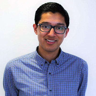 Young man in a blue shirt and wearing glasses