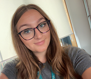 A woman wearing a school lanyard