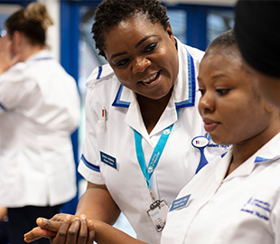 Nursing students practising their practical skills in a simulation ward