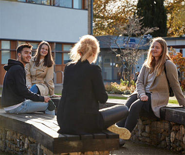Students in the University of Worcester geogarden on an Autumn day