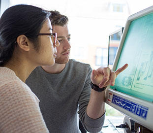 two students at a computer screen