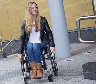 young woman with long blonde hair in a wheelchair
