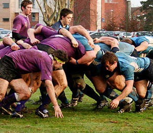 a rugby scrum with male players